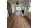 Bright living room with hardwood floors, a decorative fireplace, and ample natural light at 1104 Linwood Rd, Gastonia, NC 28052