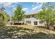 Large backyard featuring a well-maintained lawn and mature trees, offering plenty of room for activities at 11220 Cypress View Dr, Charlotte, NC 28262