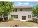 Spacious backyard with sliding glass door access to the home, perfect for outdoor entertaining and relaxation at 11220 Cypress View Dr, Charlotte, NC 28262