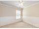 Bedroom features a window, neutral walls, crown molding, and paneled walls for added architectural detail at 11220 Cypress View Dr, Charlotte, NC 28262
