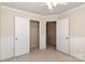 This is a bedroom with neutral walls, a closet, and paneled walls for added visual interest at 11220 Cypress View Dr, Charlotte, NC 28262
