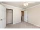 Bedroom featuring ample closet space, neutral walls, and a ceiling fan at 11220 Cypress View Dr, Charlotte, NC 28262
