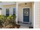 Inviting entryway featuring a classic door, decorative sidelights, and well-maintained landscaping at 11220 Cypress View Dr, Charlotte, NC 28262