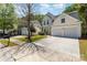 Lovely home featuring an attached two-car garage and a generous driveway, set in a peaceful neighborhood at 11220 Cypress View Dr, Charlotte, NC 28262
