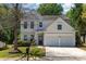 Charming two-story home featuring a two-car garage, manicured lawn, and inviting curb appeal at 11220 Cypress View Dr, Charlotte, NC 28262