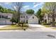 Beautiful home with a spacious driveway, well-maintained lawn, and classic architectural details at 11220 Cypress View Dr, Charlotte, NC 28262