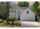 Charming two-story home featuring a two-car garage, manicured lawn, and inviting curb appeal at 11220 Cypress View Dr, Charlotte, NC 28262