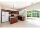 Bright kitchen boasts stainless steel appliances and a sliding glass door to backyard at 11220 Cypress View Dr, Charlotte, NC 28262