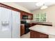 Well-lit kitchen featuring modern appliances, an island, and ample cabinet space at 11220 Cypress View Dr, Charlotte, NC 28262