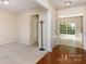 Open-concept living area with hardwood floors, bright windows, and seamless flow to other spaces at 11220 Cypress View Dr, Charlotte, NC 28262