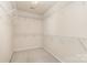 Walk-in closet with installed metal shelving, offering ample storage space at 11220 Cypress View Dr, Charlotte, NC 28262