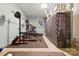 The basement gym is well-equipped with workout equipment and accessories at 1139 Hampton Gardens Ln, Charlotte, NC 28209