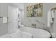 Bathroom with a standalone tub and stylish wall art at 1139 Hampton Gardens Ln, Charlotte, NC 28209
