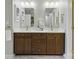 Bathroom with dual sinks, a marble countertop, and classic finishes at 1139 Hampton Gardens Ln, Charlotte, NC 28209