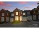 Charming brick townhouse with a well-maintained front yard and attached garage at 1139 Hampton Gardens Ln, Charlotte, NC 28209