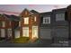 Charming brick townhouse with a well-maintained front yard and attached garage at 1139 Hampton Gardens Ln, Charlotte, NC 28209