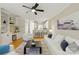 Open concept living room features a ceiling fan and a view of the kitchen at 1139 Hampton Gardens Ln, Charlotte, NC 28209