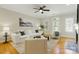 Cozy living room features hardwood floors, lots of light, and comfortable furniture at 1139 Hampton Gardens Ln, Charlotte, NC 28209