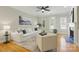 Spacious living room features hardwood floors, lots of light, and comfortable furniture at 1139 Hampton Gardens Ln, Charlotte, NC 28209