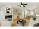 Cozy living room with fireplace, ceiling fan, built in cabinets and access to the kitchen at 1139 Hampton Gardens Ln, Charlotte, NC 28209