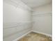 A walk-in closet with white shelving providing ample storage space at 1139 Hampton Gardens Ln, Charlotte, NC 28209