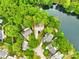 Aerial view of a neighborhood with mature trees near a lake at 11732 Borchetta Dr, Charlotte, NC 28277