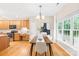 Open dining room and kitchen area with ample natural light and hardwood flooring at 11732 Borchetta Dr, Charlotte, NC 28277