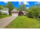 Charming brick home featuring a well-manicured lawn and attached two-car garage at 11732 Borchetta Dr, Charlotte, NC 28277