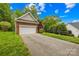 Brick home with an attached garage and a well-maintained front lawn at 11732 Borchetta Dr, Charlotte, NC 28277