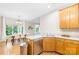 View of a well-maintained kitchen with a sink, and a stainless steel dishwasher, open to the dining room at 11732 Borchetta Dr, Charlotte, NC 28277
