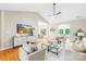 Spacious living room featuring vaulted ceilings, a ceiling fan and hardwood floors at 11732 Borchetta Dr, Charlotte, NC 28277