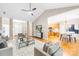 Open-concept living room with vaulted ceiling, hardwood floors, and modern furnishings at 11732 Borchetta Dr, Charlotte, NC 28277
