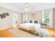 Inviting main bedroom features tray ceiling, ceiling fan, and lots of natural light at 11732 Borchetta Dr, Charlotte, NC 28277