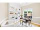 Well-lit home office featuring a large built-in bookshelf and a window at 11732 Borchetta Dr, Charlotte, NC 28277