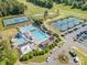 Stunning aerial view of community pool, tennis courts, and meticulously maintained landscaping at 12004 Willingdon Rd, Huntersville, NC 28078