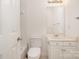 Bathroom featuring a white toilet, cabinets, and neutral walls at 12004 Willingdon Rd, Huntersville, NC 28078