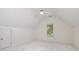 Well-lit bedroom with neutral carpet, paint, and a bright window at 12004 Willingdon Rd, Huntersville, NC 28078