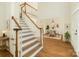 Inviting foyer with hardwood floors, staircase, and dining room, creating a warm and welcoming atmosphere at 12004 Willingdon Rd, Huntersville, NC 28078