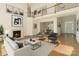 Elegant living room with hardwood floors, fireplace, and neutral decor, offering a comfortable and inviting space at 12004 Willingdon Rd, Huntersville, NC 28078