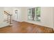 Bright and airy room with hardwood floors, a window and staircase, perfect for relaxing or entertaining at 12004 Willingdon Rd, Huntersville, NC 28078