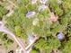 Aerial view of a large lot surrounded by lush greenery at 142 Gray Barn Dr, Troutman, NC 28166