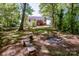 Expansive backyard featuring a fire pit and bench seating, perfect for outdoor gatherings at 142 Gray Barn Dr, Troutman, NC 28166