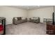 Finished basement area featuring carpeted floors, recessed lights, and neutral colors at 142 Gray Barn Dr, Troutman, NC 28166