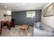 Cozy basement space with a desk, and a gray accent wall at 142 Gray Barn Dr, Troutman, NC 28166