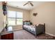 Well-lit bedroom with a twin bed, carpeted floors, and a window at 142 Gray Barn Dr, Troutman, NC 28166