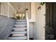 Staircase leading up from the foyer with modern railings at 142 Gray Barn Dr, Troutman, NC 28166
