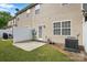 This is a backyard with a patio, grass, siding, and fence at 14649 Lions Paw St, Charlotte, NC 28273