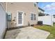 This is a backyard with a patio, grass, siding, and fence at 14649 Lions Paw St, Charlotte, NC 28273