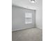 Bright, empty bedroom features neutral walls, carpeted floor, and a window bringing in natural light at 14649 Lions Paw St, Charlotte, NC 28273