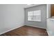 Bright bedroom featuring hardwood flooring and a large window that provides natural light at 14649 Lions Paw St, Charlotte, NC 28273